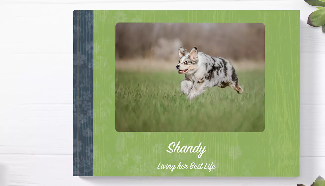 Greenery-themed photo book featuring a dog on the front cover, capturing nature-inspired moments - banner