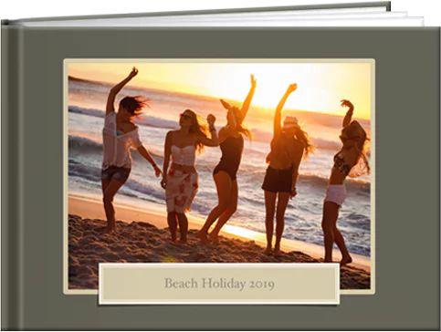 Beach holiday photo book featuring youngsters enjoying the sunset, capturing a serene moment