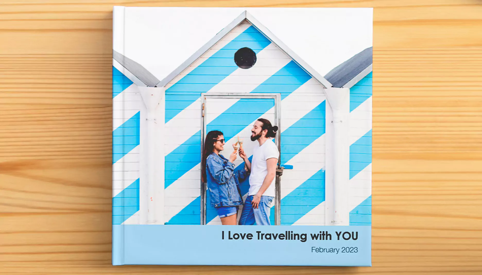 Trendy photo book featuring a young couple on the cover, with a blue and white striped design - banner