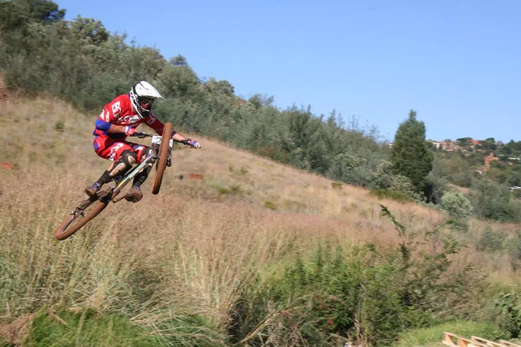 Sick shot of a boy airborne on his back, performing an impressive stunt during the Radman Rapid Studio downhill event