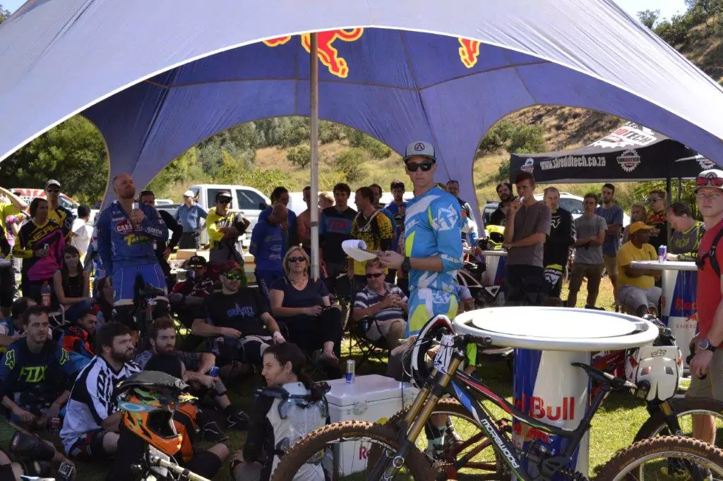 Participants gathering in the tent at the Radman Rapid Studio downhill event, socialising and preparing for the race