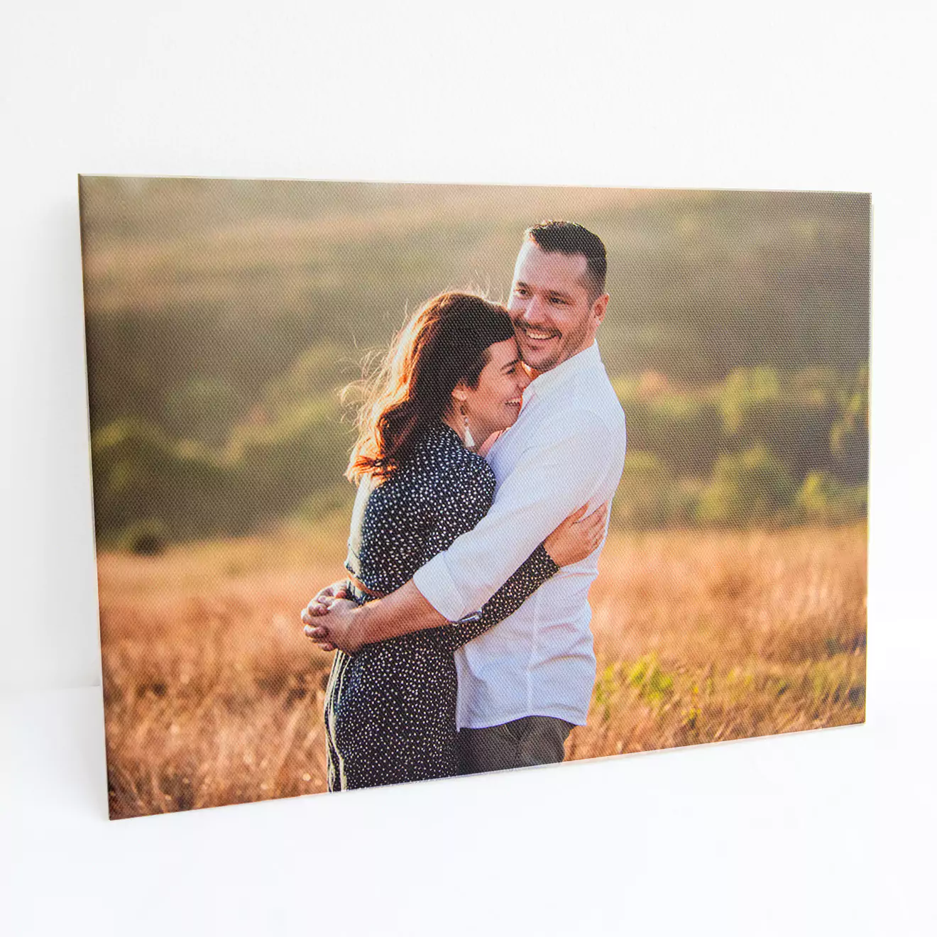 Picture of a loving couple mounted on a skinny canvas, creating a stylish and modern display of their special moment