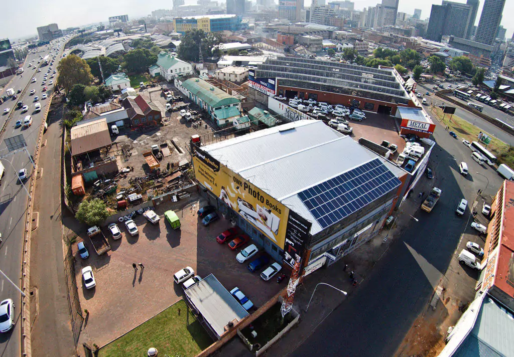 Aerial shot of RapidStudio's factory, highlighting the solar panels installed on the roof for sustainable energy