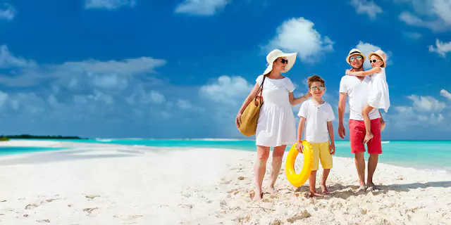 Adventures on the beach with a family of four, captured for a fun and memorable photo book