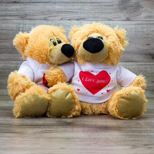 Personalised teddy bears wearing shirts that say "I Love You," offering a heartfelt and thoughtful gift