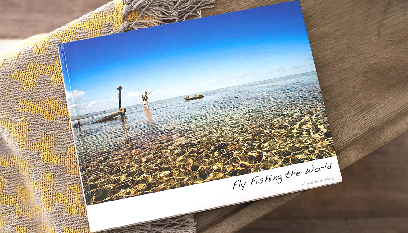 A beautiful fly-fishing coffee table photo book, capturing serene moments and stunning landscapes from the fishing adventure - banner