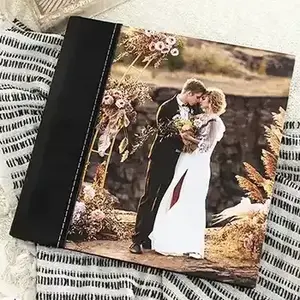 RapidStudio ultimate coffee table photobook album with black leather printed cover and white stitching